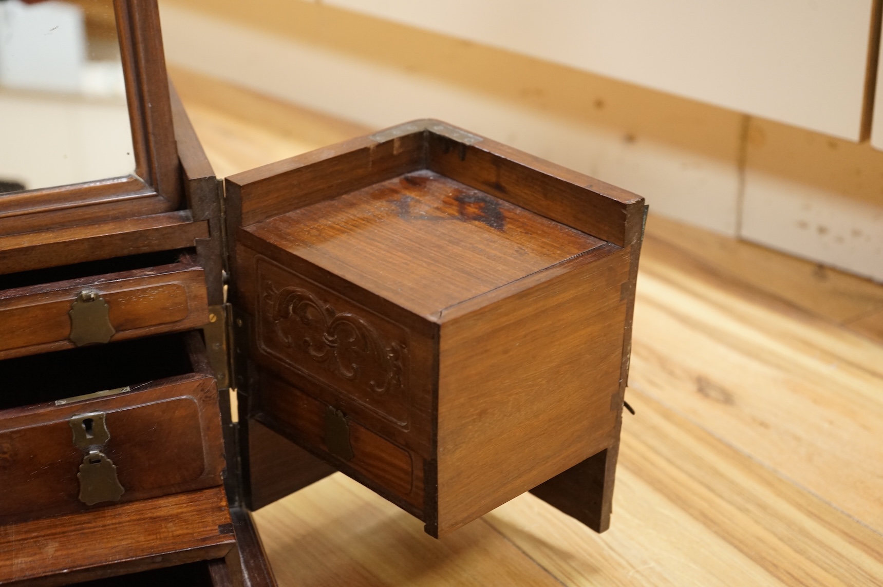 A Chinese rosewood brass bound dressing chest, closed 39cm deep, 29cm wide, 23cm high.